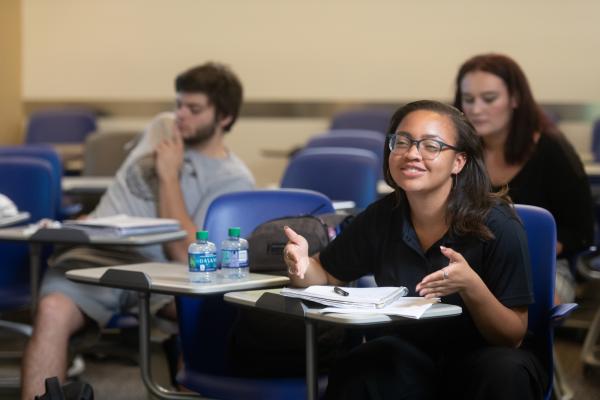 Student Kayla M. Collins in a class on happiness.