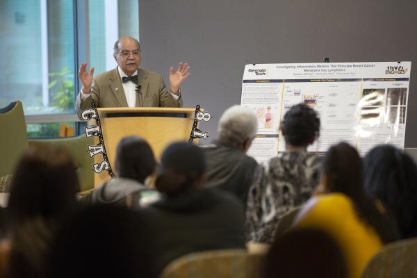 Rapael Lee addresses a packed Petit Institute atrium. (Credit: Sean McNeil, Georgia Tech Research Institute)