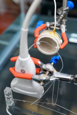 The parabolic shape helps researchers focus ultrasound energies to concentrate them on an area. This is a set-up in Costas Arvanitis's Georgia Tech lab to test the device and is not part of a treatment or experiment. Credit: Georgia Tech / Rob Felt