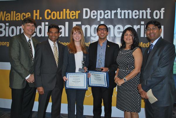 Elizabeth Carpenter and Mohamed Ali Najia (center, with awards) won the Dr. G.D. Jain Outstanding Senior Award and the Mr. S.K. Jain Outstanding Research Award.