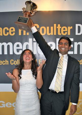 Karthik Nathan plays keepaway with Maria Diaz Ortiz, the former Petit Scholar who won the Tau Beta Pi Award, at the BME Leadership Awards Reception.