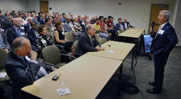 Parker H. "Pete" Petit addresses a packed Suddath Room (and an overflow crowd in the atrium) during the 20th anniversary celebration.