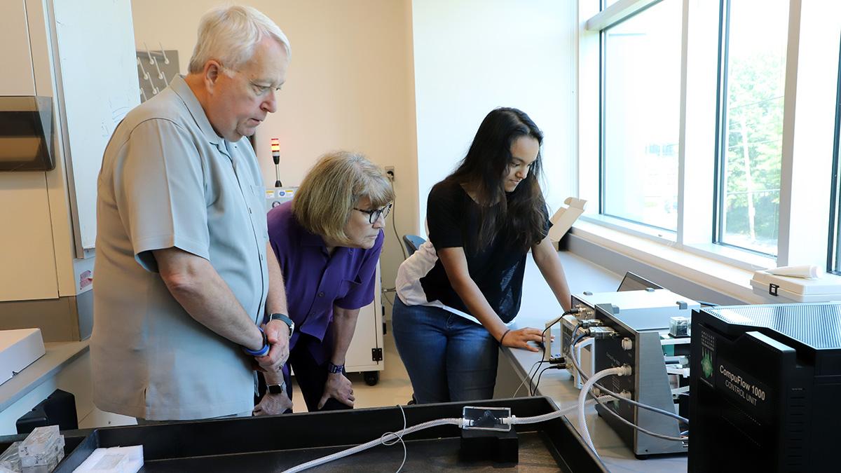 During a lab tour, master’s student Sahar Ibrahim, right, shows Scott and Arline Alexander an example of a 3D-printed vascular structure that can be designed to mimic a specific patient’s anatomy. Ibrahim works with David Frakes, a Coulter BME associate professor. (Photo: Joshua Stewart)