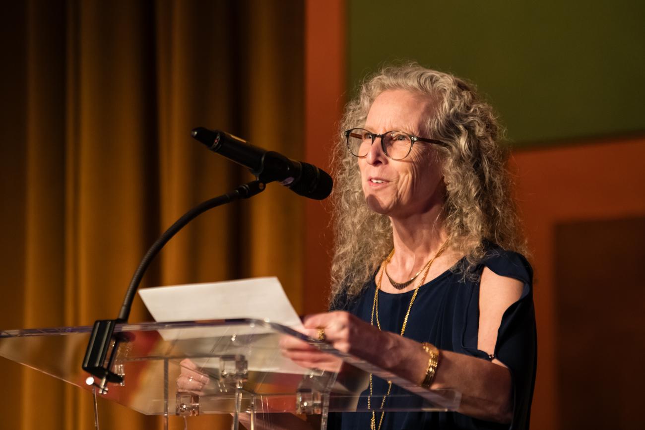 Photo of Alyssa Panitch speaking at a podium